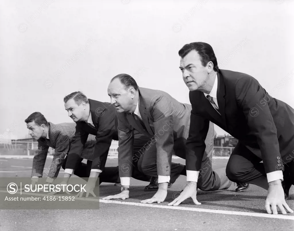 1960S Four Businessmen On The Starting Line