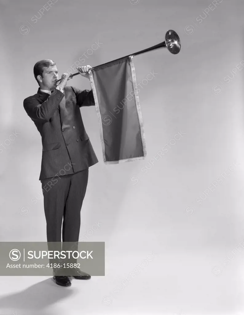 1960S Young Man Standing Blowing Herald'S Horn