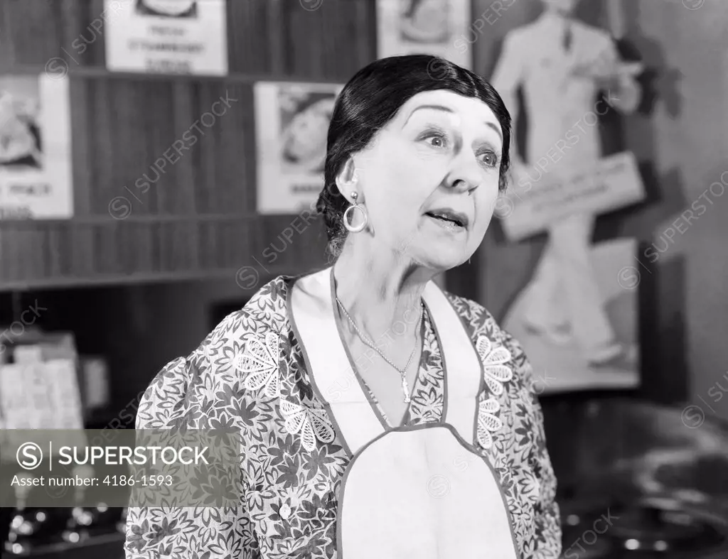 1930S Woman Wearing Apron Making Funny Expression Questioning 