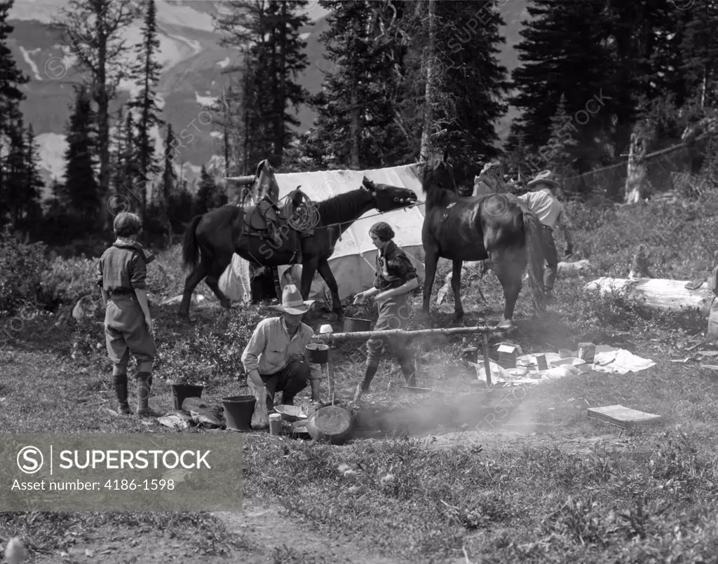 1930S Group Men Women At Campsite Cooking Fire Horses Campfire Wilderness Adventure Cowboy Tent Canada Assiniboine