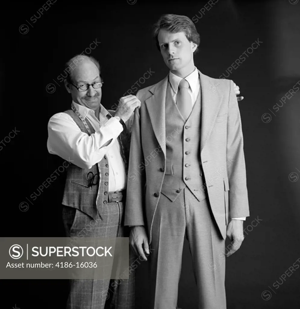 1980S Smiling Tailor Fitting Three Piece Suit On Business Man Adjusting Shoulders Custom Made Alteration