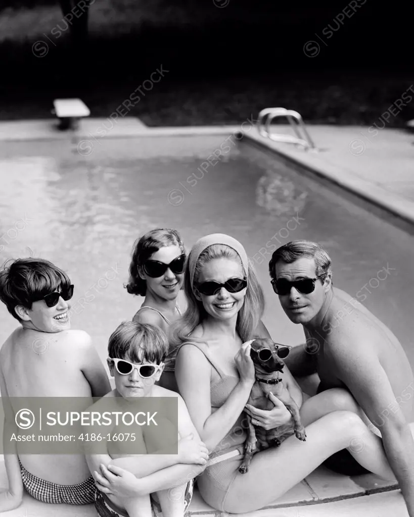 1960S 1970S Family Portrait Father Mother Sons Daughter Swimming Pool Side With Dachshund Dog All Wearing Sunglasses