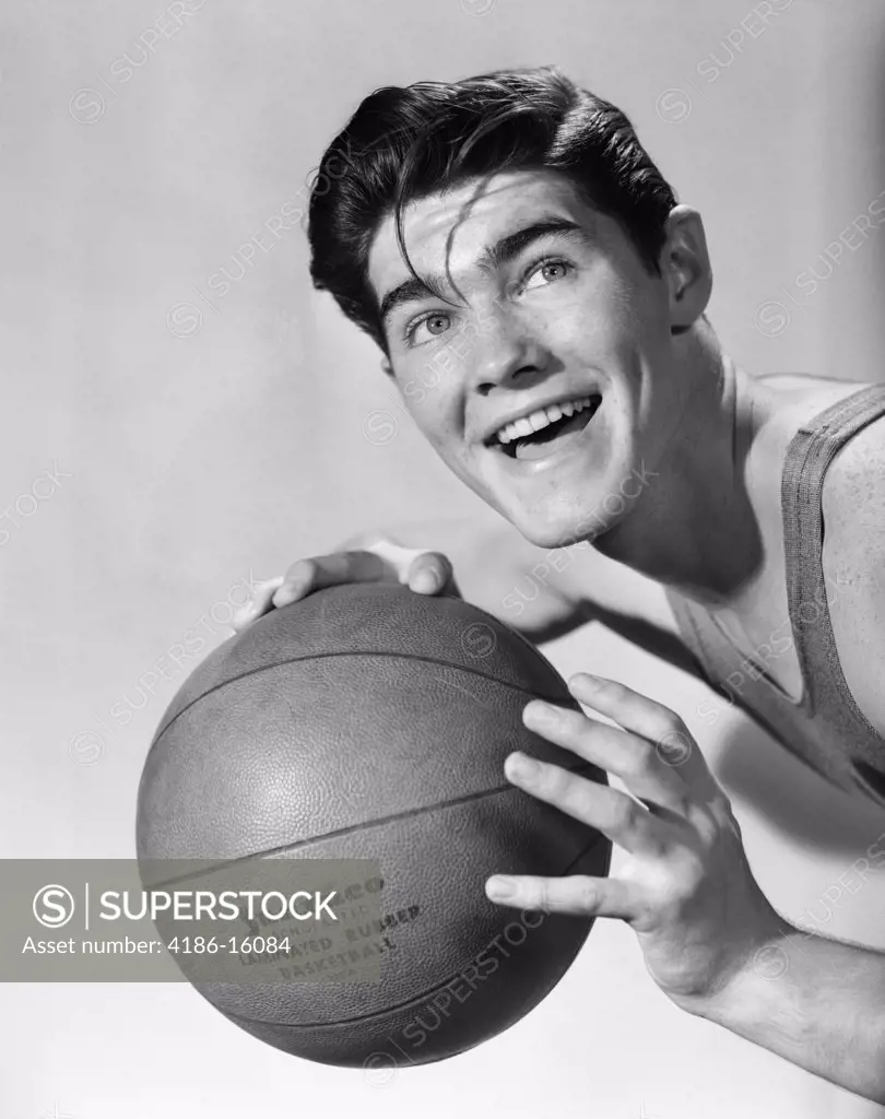 1950S Boy Posing Holding Basketball Smiling