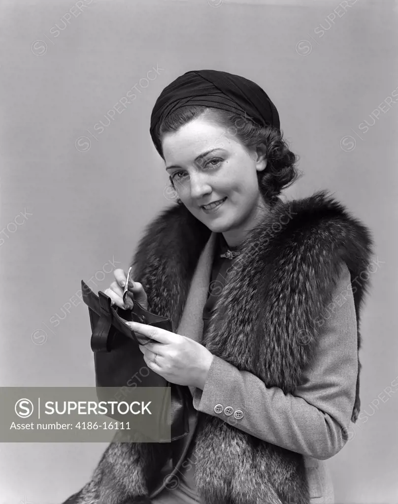 1930S 1940S Woman Dressed Up With Fur Jacket Holding Purse With Money