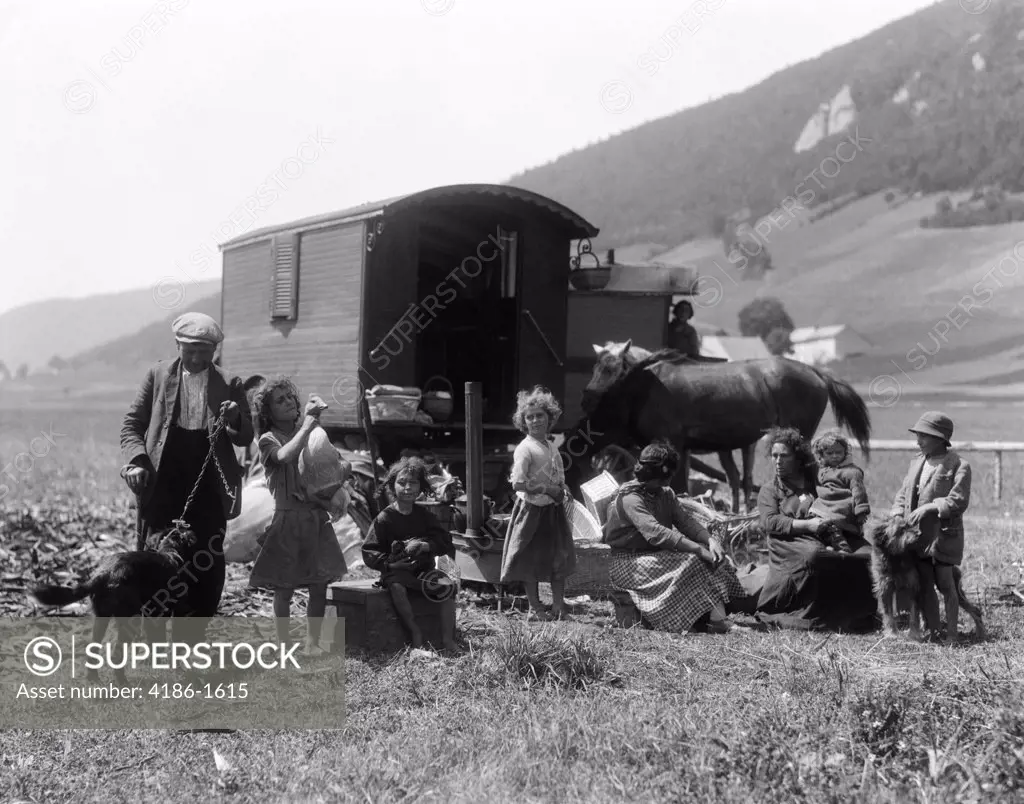 1930S Swiss Nomads With Gypsy Wagon Dressed In Peasant Clothing In Alpine Meadow Valley