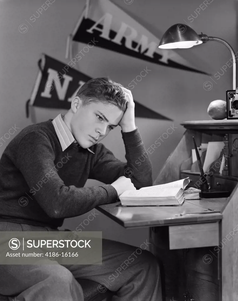 1940S Young Boy Studying In Room With Army Banners In Background