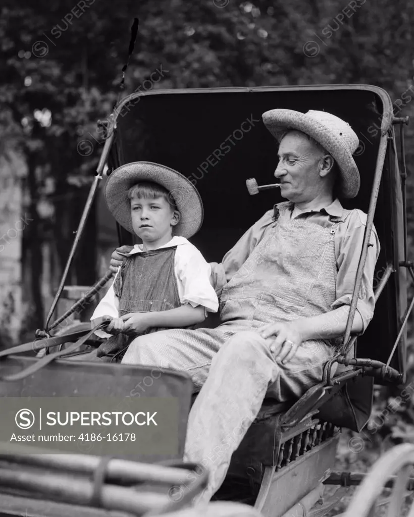 1930S Farm Boy & Grandfather In Overalls & Straw Hats Sitting In Small Buggy