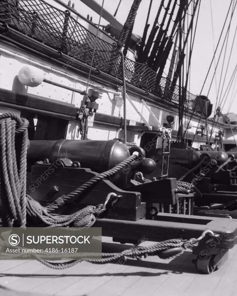 Row Of Cannon Breeches On Gun Deck Of Sailing Naval Ship Of War