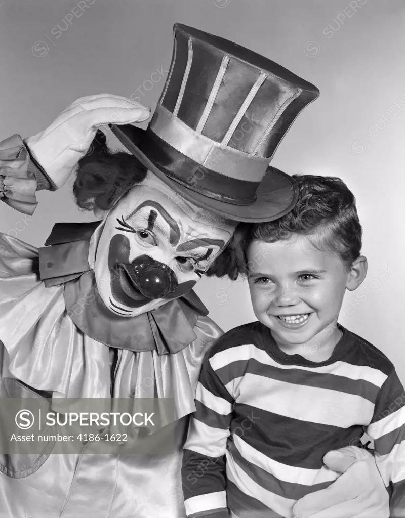 1950S Clown With Top Hat Arm Around Boy In Striped Shirt
