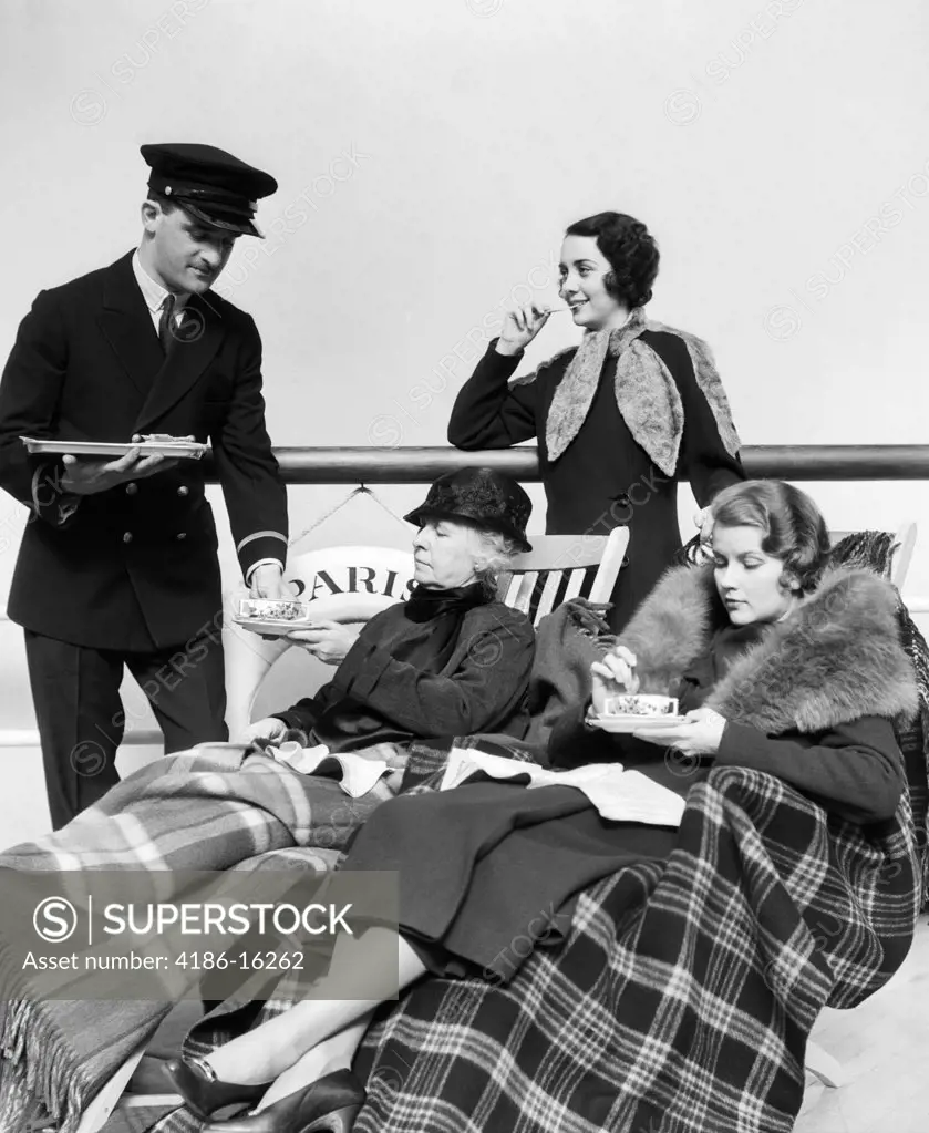 1930S Three Women Being Served Tea By A Steward On Board An Ocean Liner Crossing The Atlantic Ocean