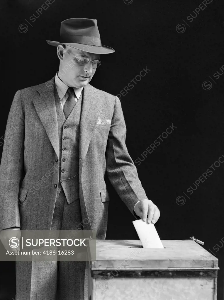 1940S Man Putting Ballot In Box