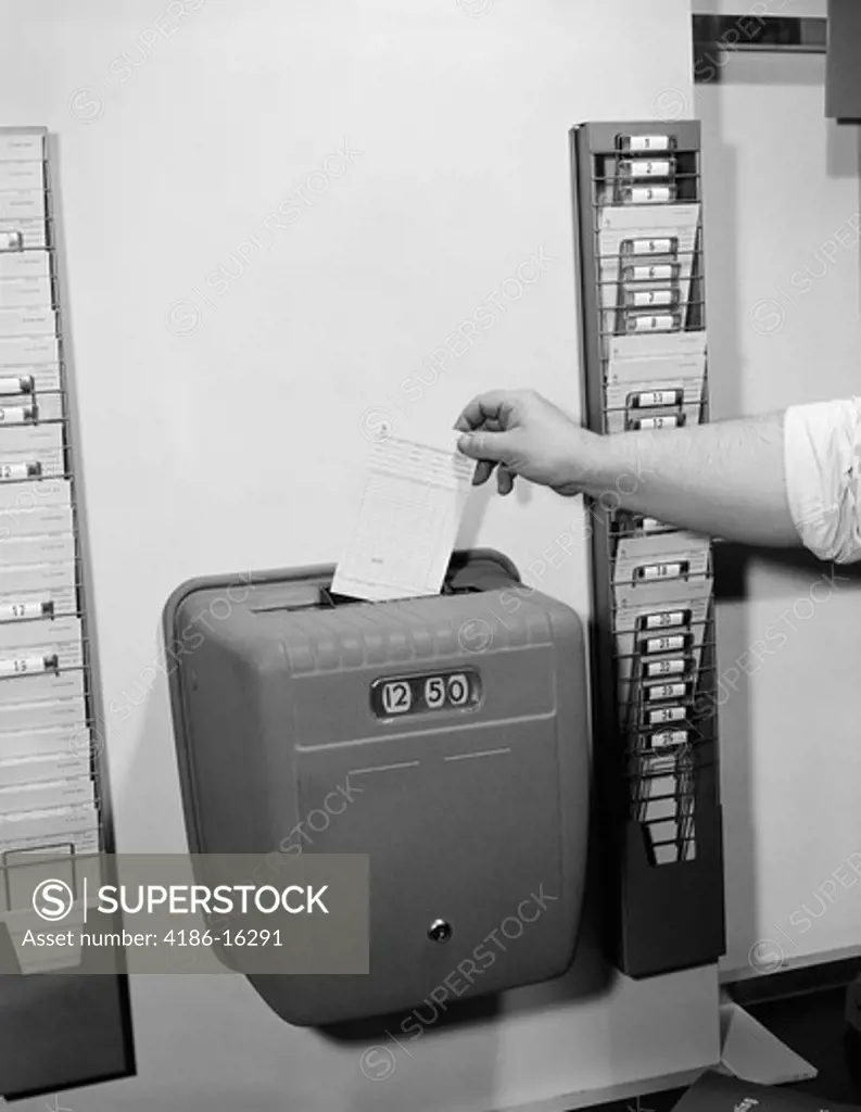 1950S Male Hand Dropping Card Into Time Clock Punching In Out