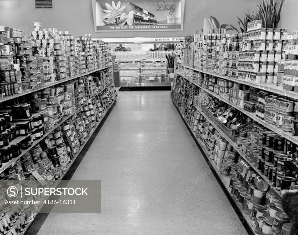1950S Empty Grocery Store Aisle With Canned Goods On Shelves To Either Side