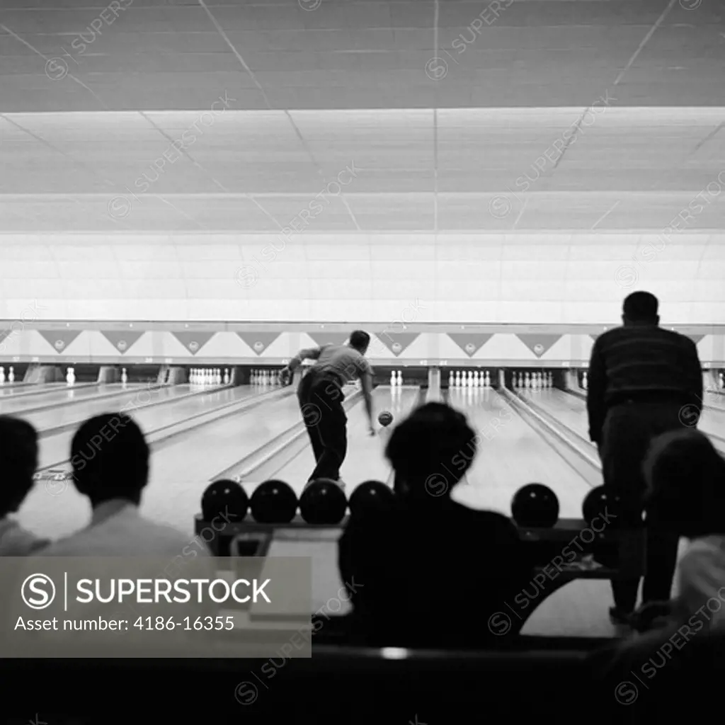1940S 1950S Bowling Alley Showing Lanes Man Bowling Silhouetted Crowd Watching