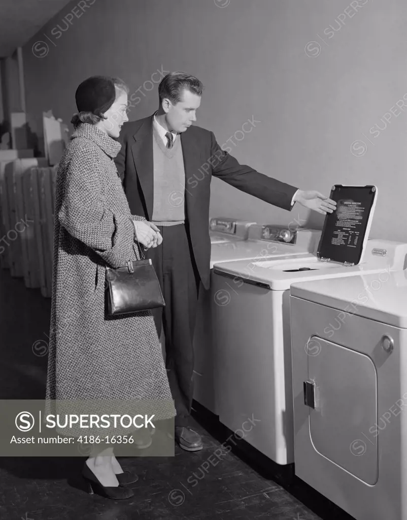 1950S Young Couple Man Woman Shopping For Washing Machine  