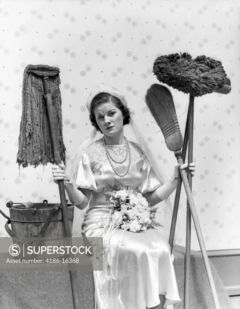 1930S Bride Seated Next To Bucket With Bouquet In Lap Holding Mops & Brooms & Looking Distressed
