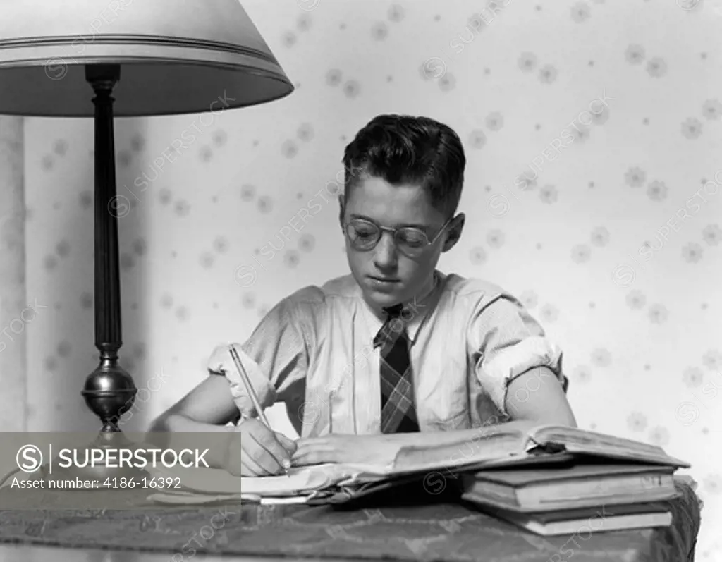 1940S Young Boy Wearing Glasses Studying Writing