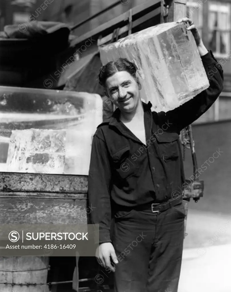 1930S Ice Delivery Man Carrying Large Block Of Ice On Shoulder