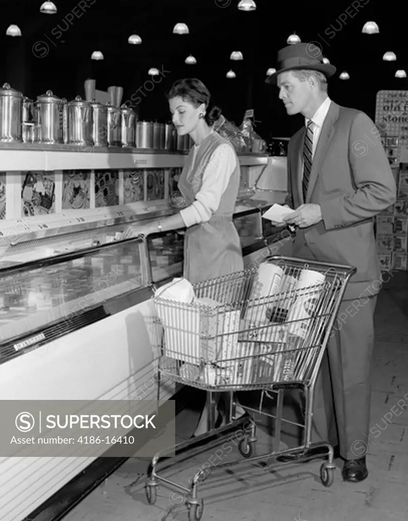 1950S Couple In Supermarket At Freezer With Shopping Cart