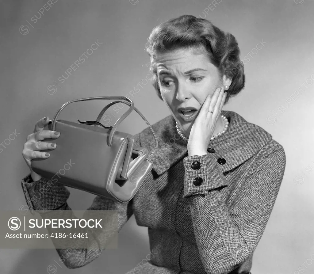 1950S Woman With Exaggerated Expression Hand On Face Looking Inside Her Purse