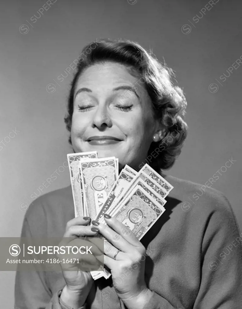 1950's Portrait Of Woman Smiling With Eyes Closed Holding Money