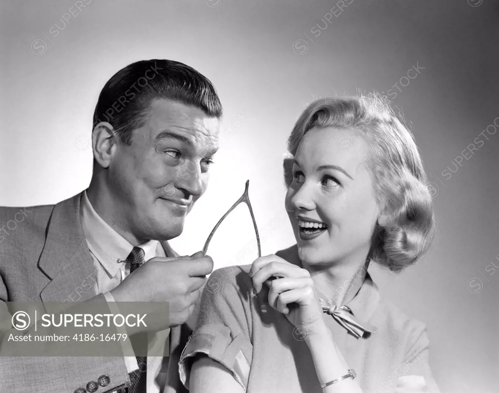 1950S Portrait Of Couple Holding Wishbone
