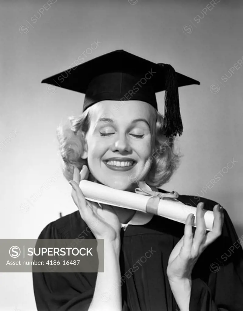 1950S Smiling Woman Teenage Girl Eyes Closed Holding Diploma Graduate Wearing Cap Gown