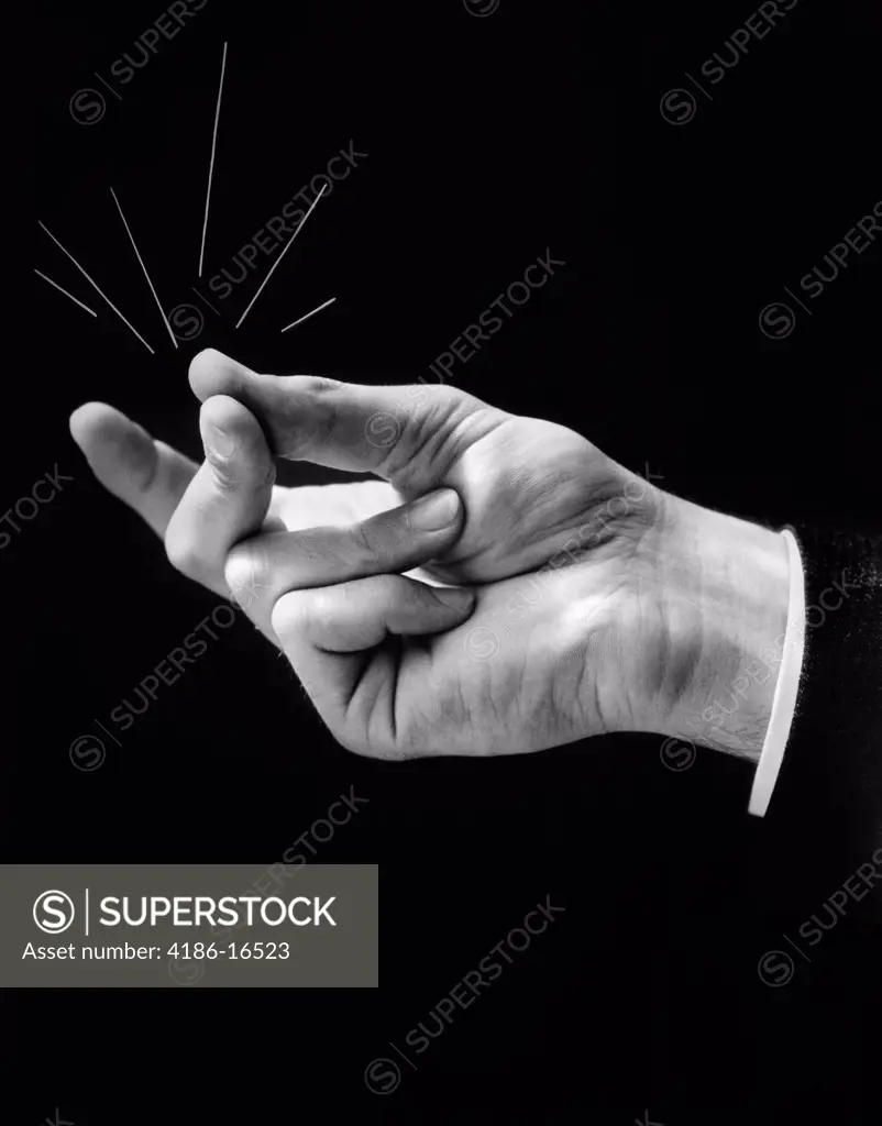 1930S Man'S Hand Snapping With Lines Drawn Out To Imply Effect Of Noise & Friction