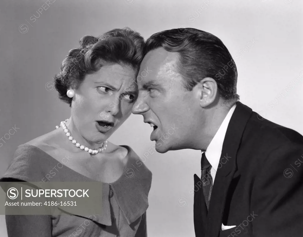 1950S Couple Arguing Yelling Foreheads Touching Indoor