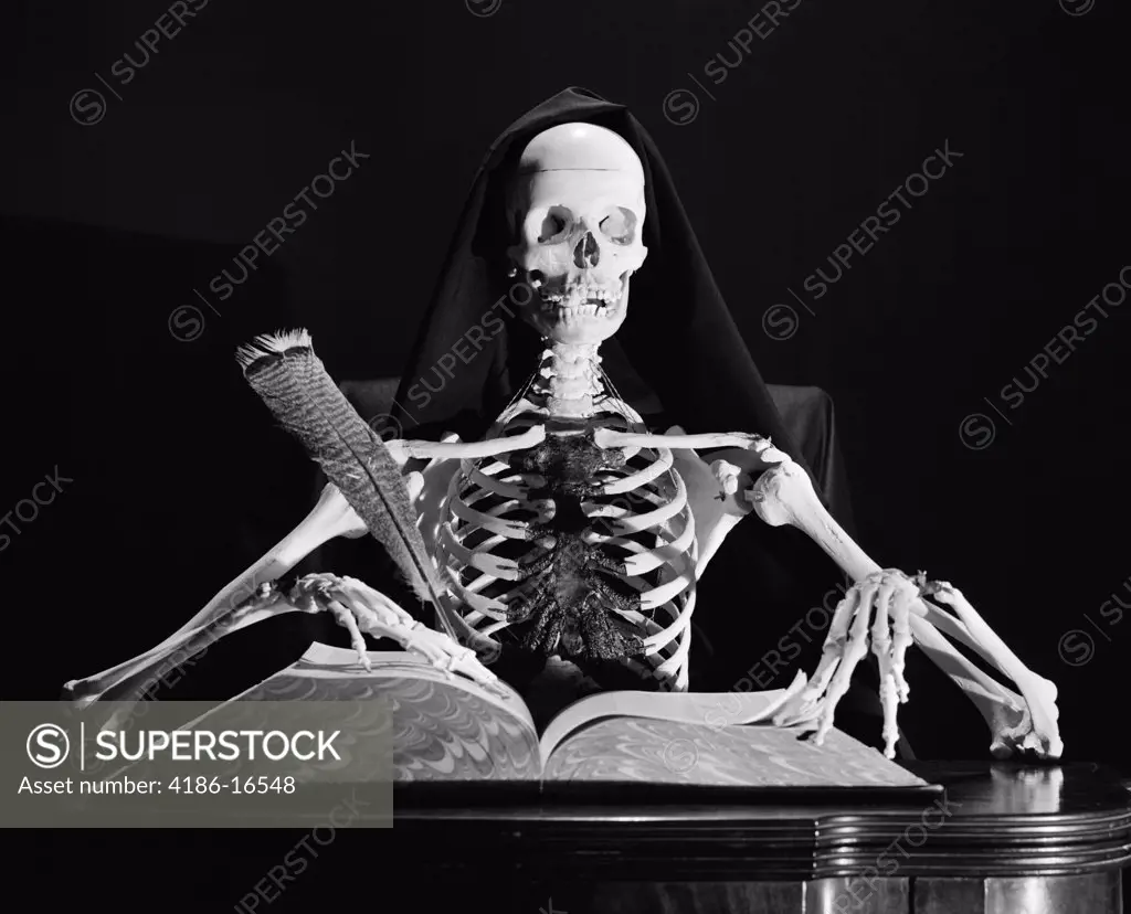 Still Life Of Skeleton Writing In Large Book With Quill Pen