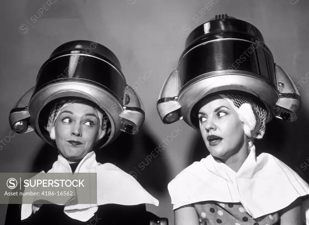 1950S Two Women Sitting Together Gossiping Under Hairdresser Hair Dryer