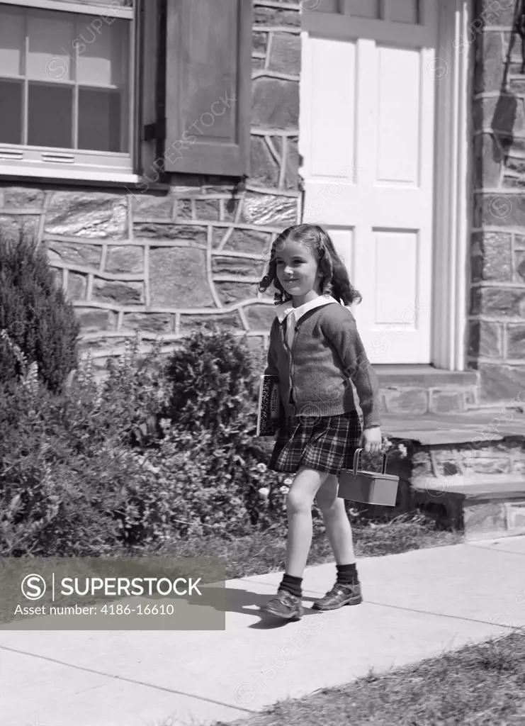1940S Girl Walking To School Outside Of Home Doorway Window Lunch Pail