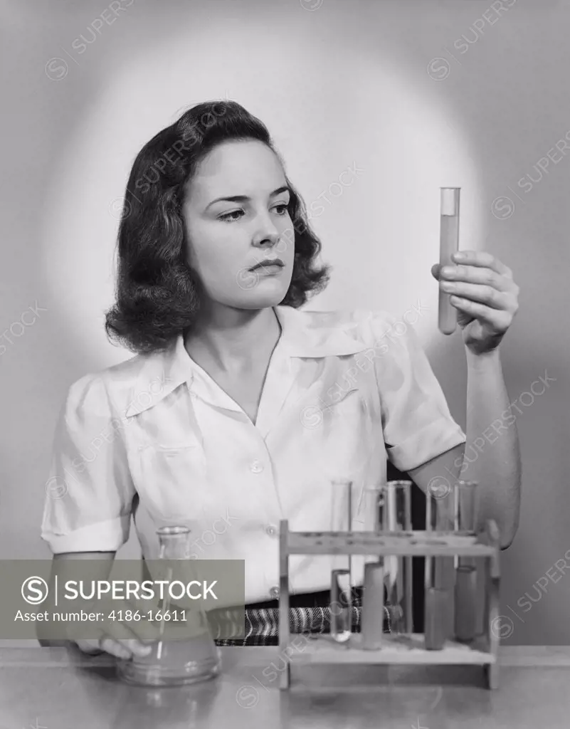 1940S Young Woman Chemist Holding Up Test Tube