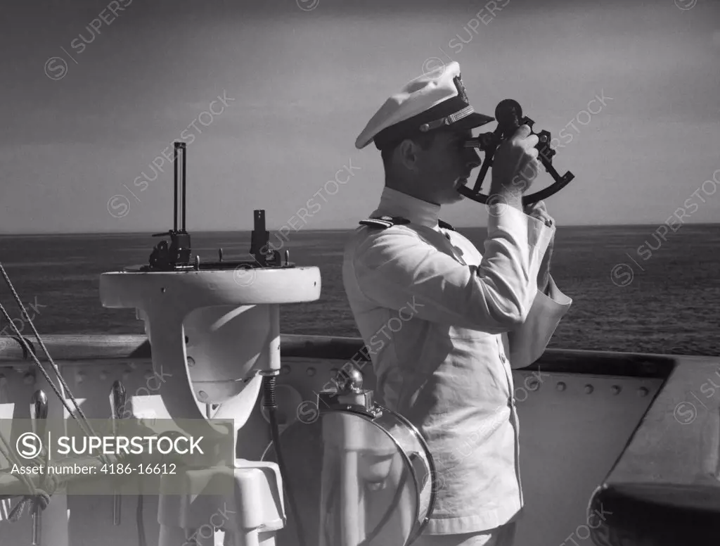 1940S Man Sailor Captain Officer Using Sextant On Bridge Of Ship Navigation Latitude Longitude Calculation Navy