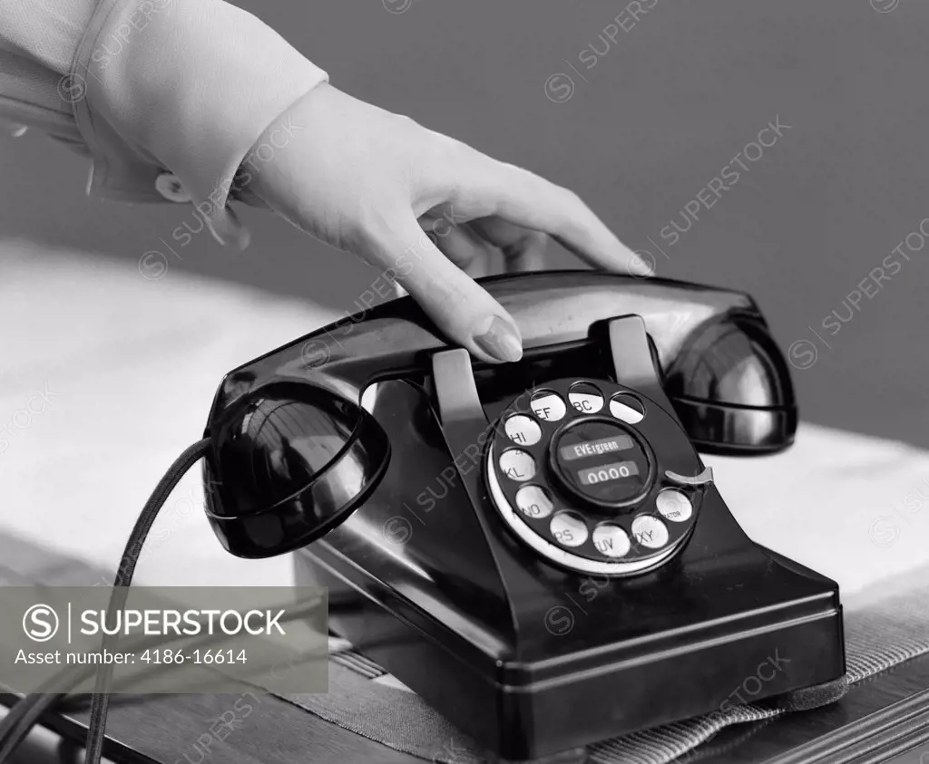 1940S Woman'S Hand Picking Up Phone Receiver