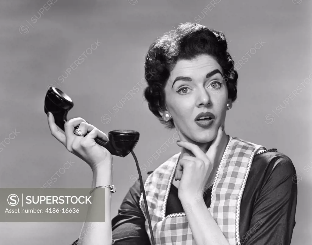 1950S Confused Woman Housewife Holding Up Telephone Receiver Facial Expression