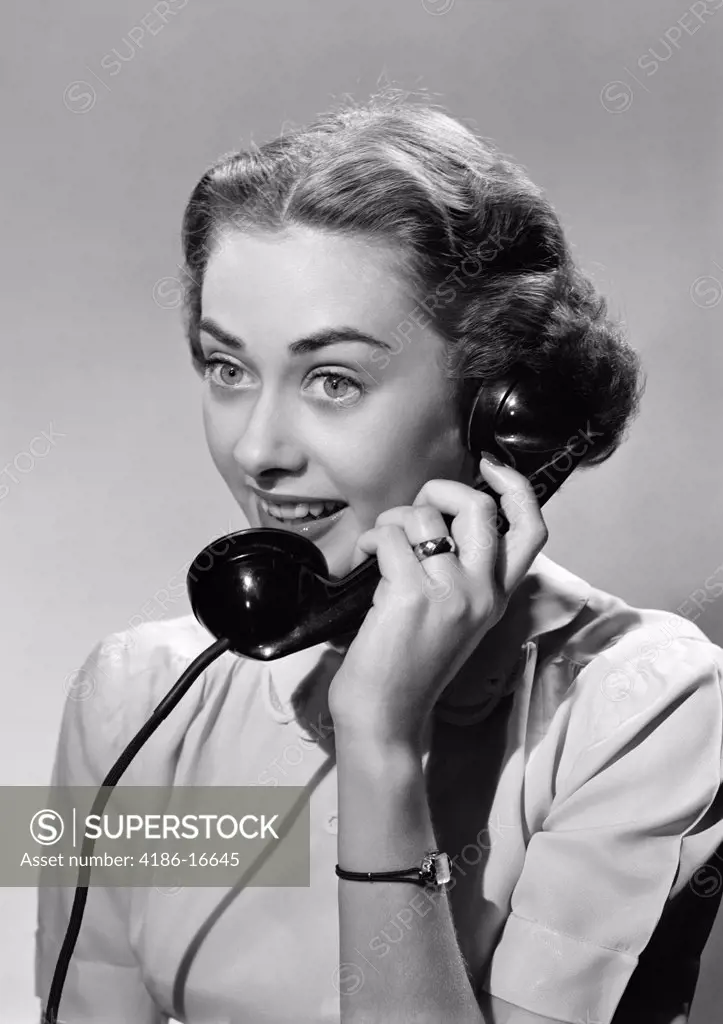 1950S Smiling Woman Talking On Telephone