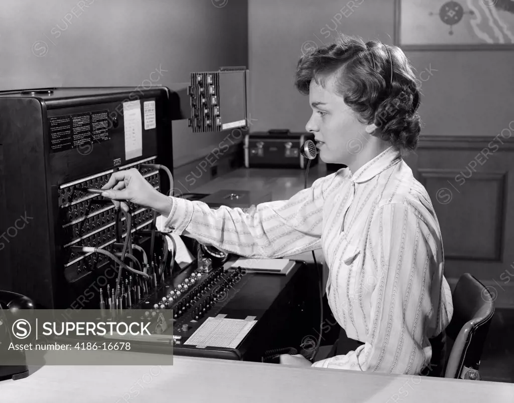 1950S Woman Office Telephone Switchboard Receptionist Operator Wearing Headset Answering Transferring Call Lines
