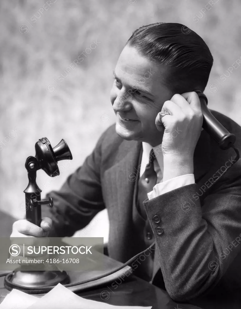 1920S Businessman Talking Into Candlestick Telephone
