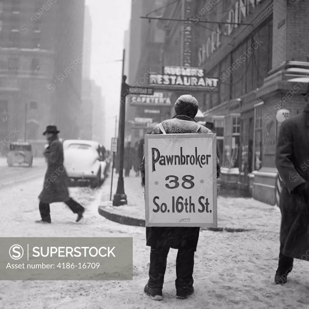 1930S Winter Street Scene Of Man Wearing Pawnbroker Sandwich Board