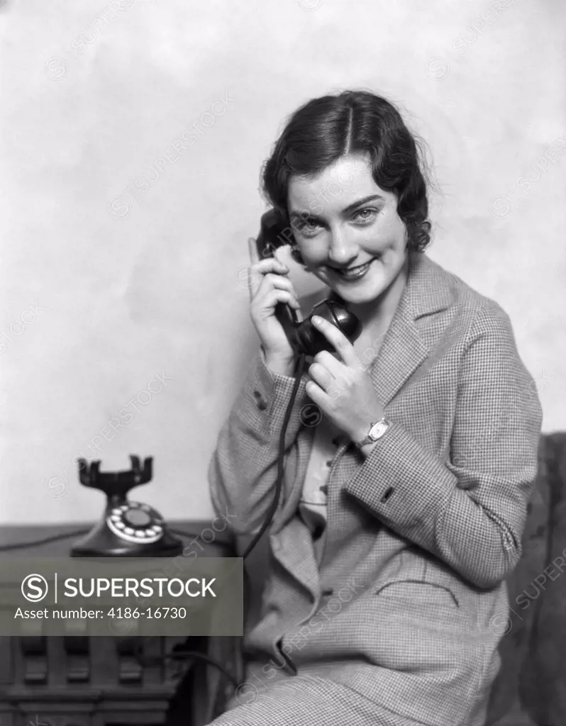 1920S Smiling Woman Talking On Telephone