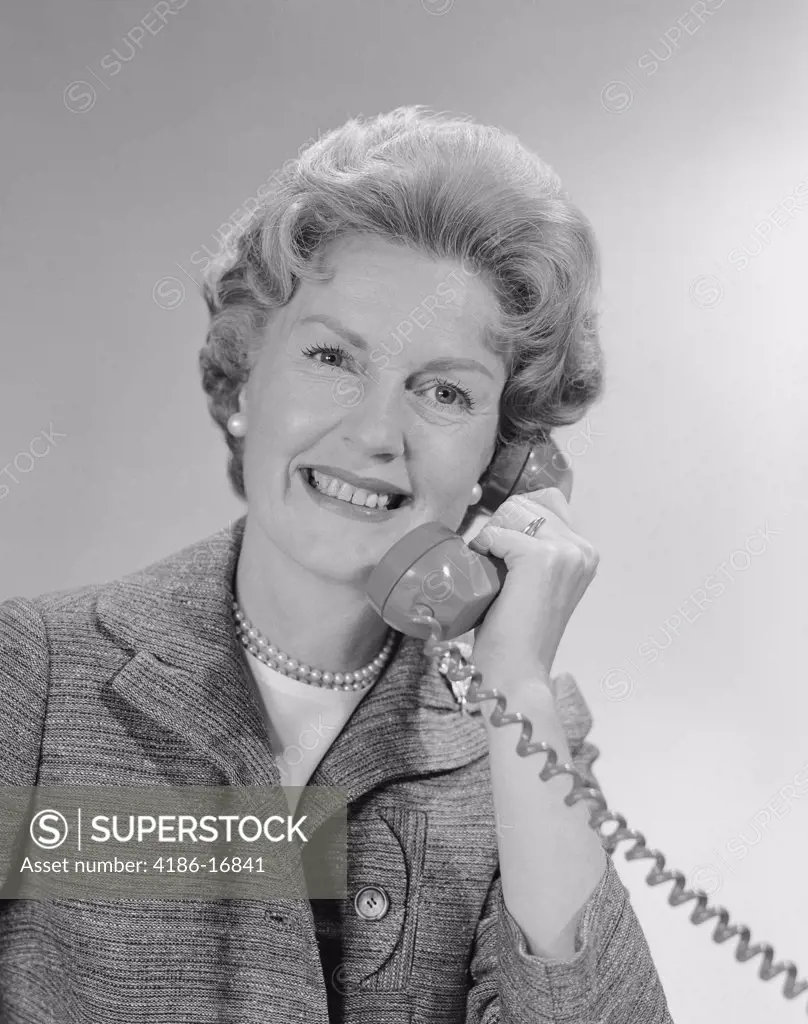 1960S Portrait Smiling Mature Woman Talking On Telephone 