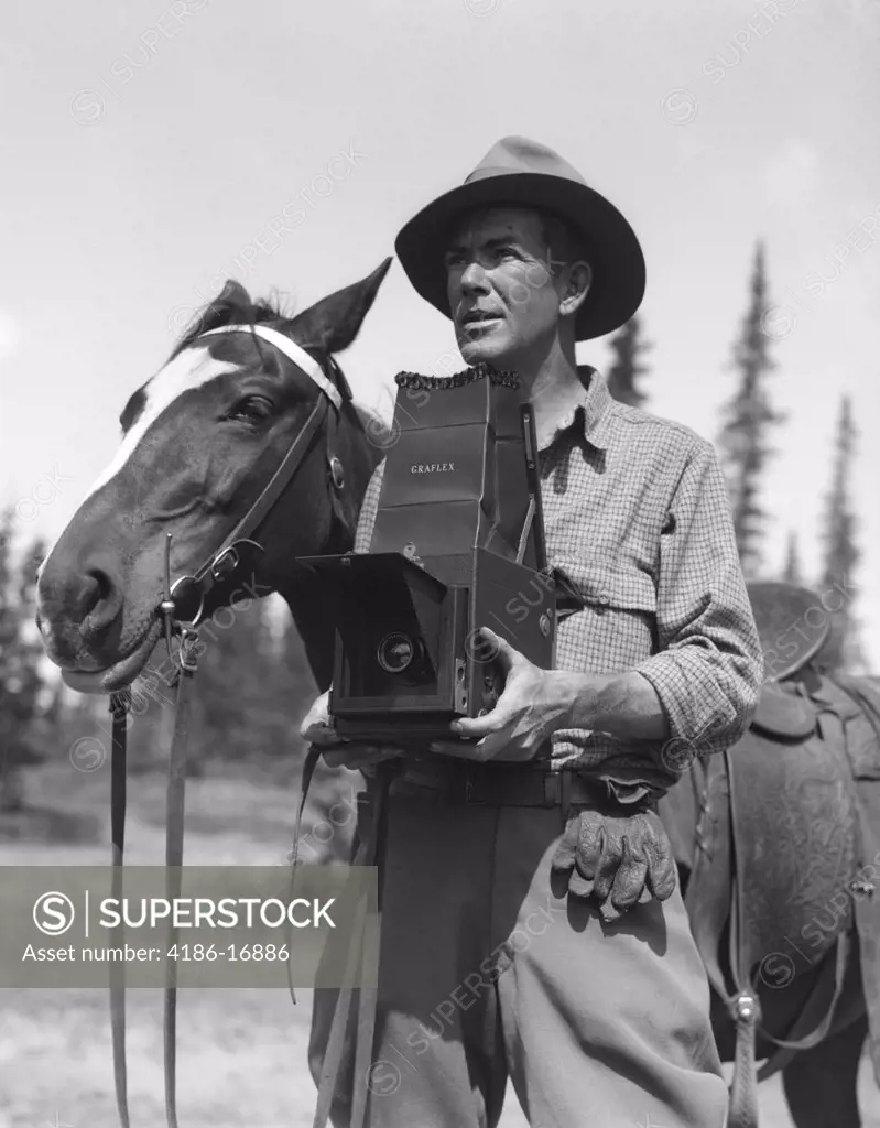 1930S Man Photographer In Fedora & Jodhpurs Holding Graflex Camera Standing Next To Saddled Horse