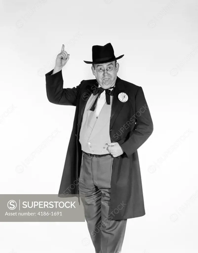 1960S Man In Old-Time Politician Costume Wearing Candidate'S Button Pointing Index Finger In Air