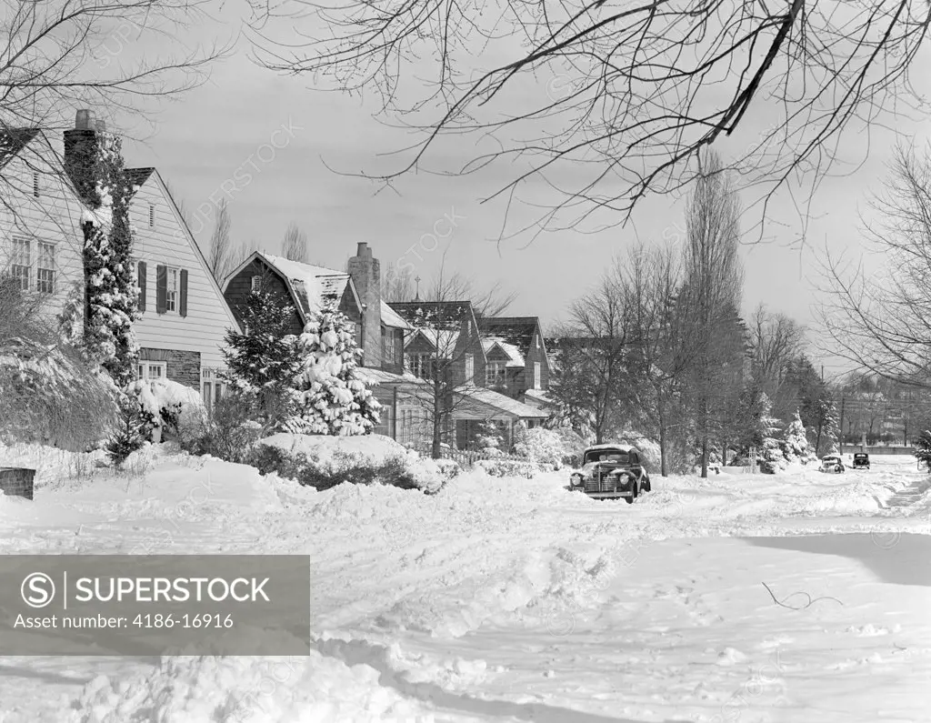 1940S Suburban Winter Scenic Street Houses And Cars Covered In Snow