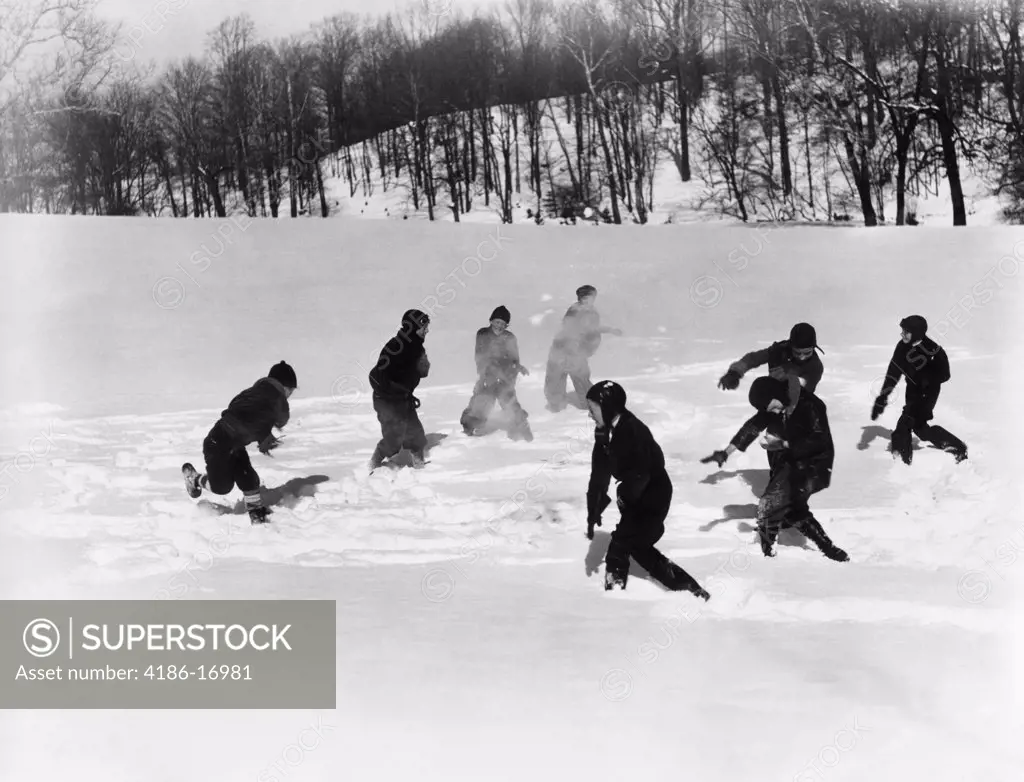 1930S Group 8 Boys Two Teams Of Four Having A Massive Snowball Fight In Snow Covered Field