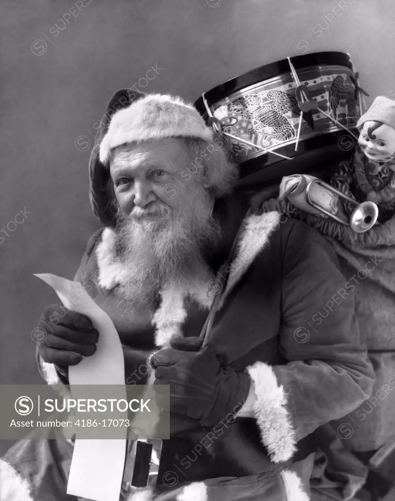 1930S Santa With Sack Of Toys Over Back Checking His List