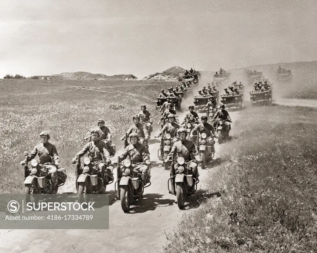 1940s US ARMY RECONNAISSANCE MOTORCYCLE SOLDIERS LEADING CONVOY OF JEEPS AND TRUCKS DURING FIELD TRAINING MANEUVERS BEFORE WW2