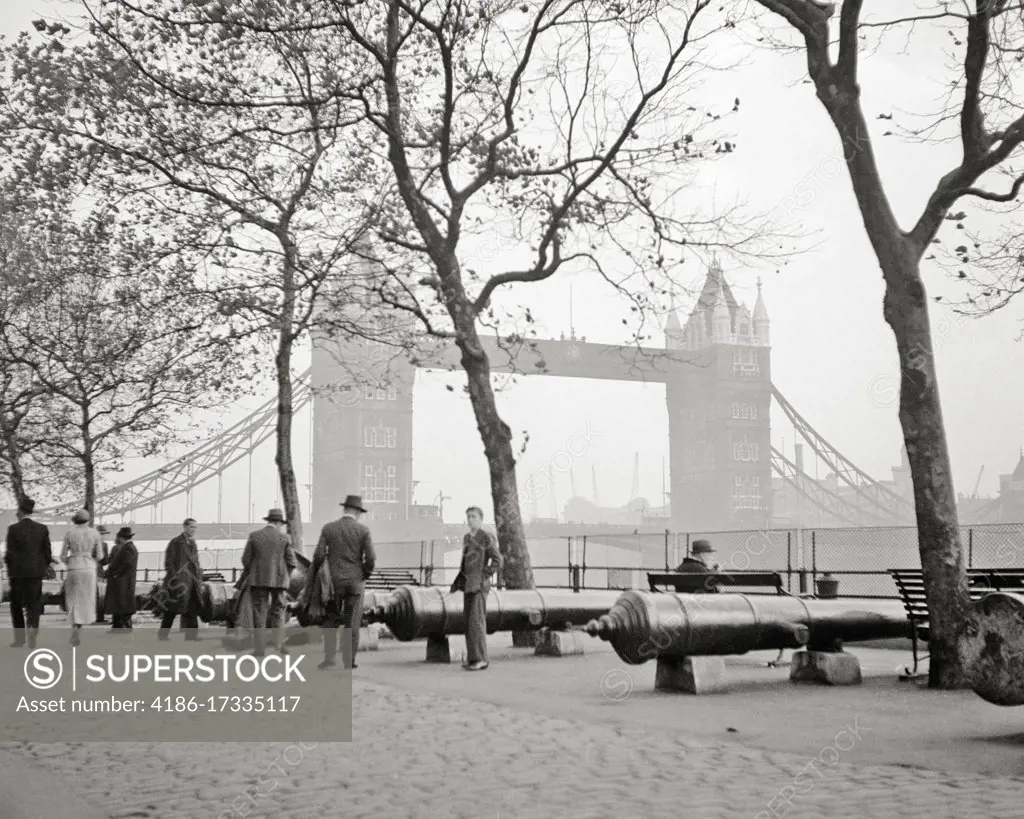 1930s SHADOWY TOWER BRIDGE SEEN FROM THE EMBANKMENT LONDON ENGLAND UNITED KINGDOM 