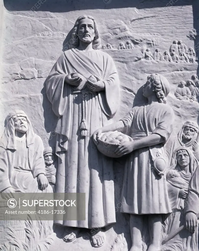 Bas Relief Of Jesus Breaking A Loaf Of Bread Depicting The Miracle Of Loaves And Fishes